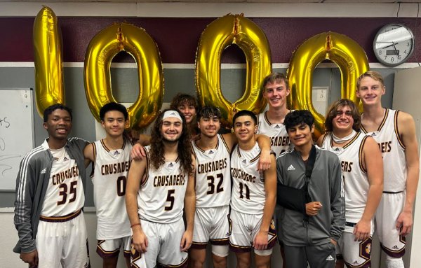 Kings Christian Crusader junior, Ronnie Roche, scores his 1,000th point in decisive hoops win over visiting Clovis Christian Ronnie Roche, No. 32, celebrates his 1,000th point with teammates Thursday night at Kings Christian High School. Roche is only a junior.